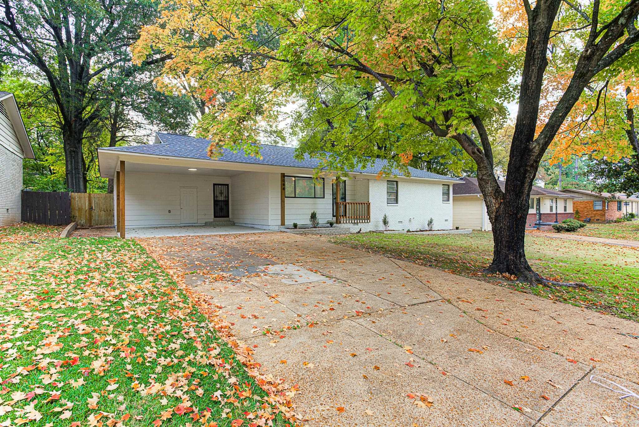 5094 Lochinvar Road Memphis, TN 38116 - Photo 1 of 23 Ranch-style home with a front lawn and a carport