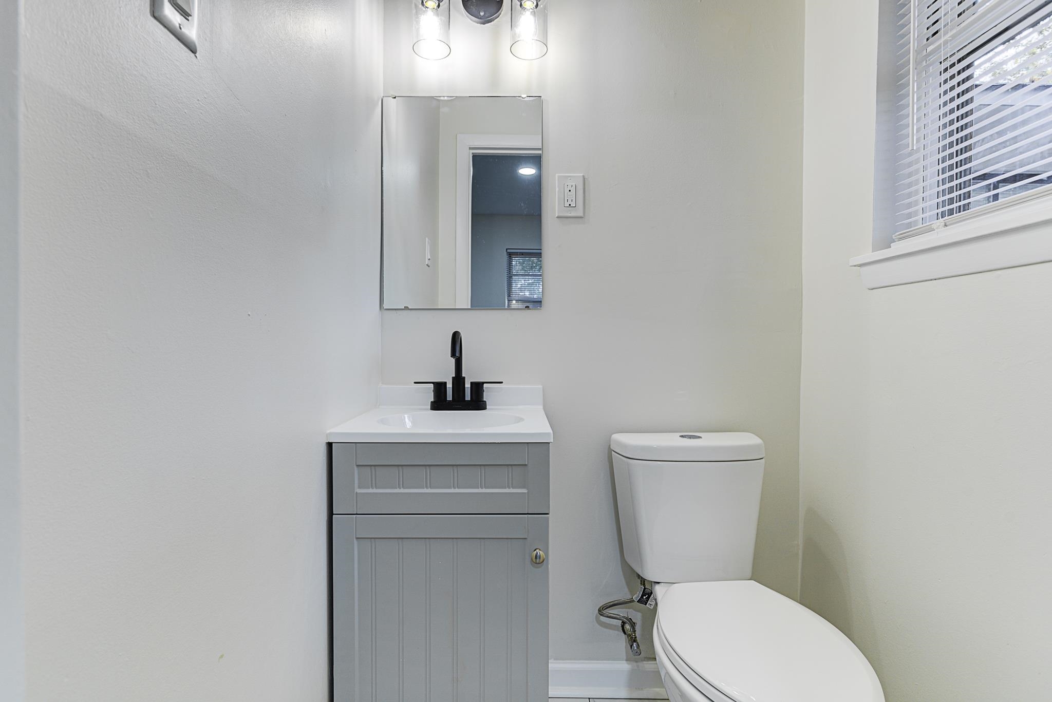 5094 Lochinvar Road Memphis, TN 38116 - Photo 14 of 23 Bathroom with vanity and toilet