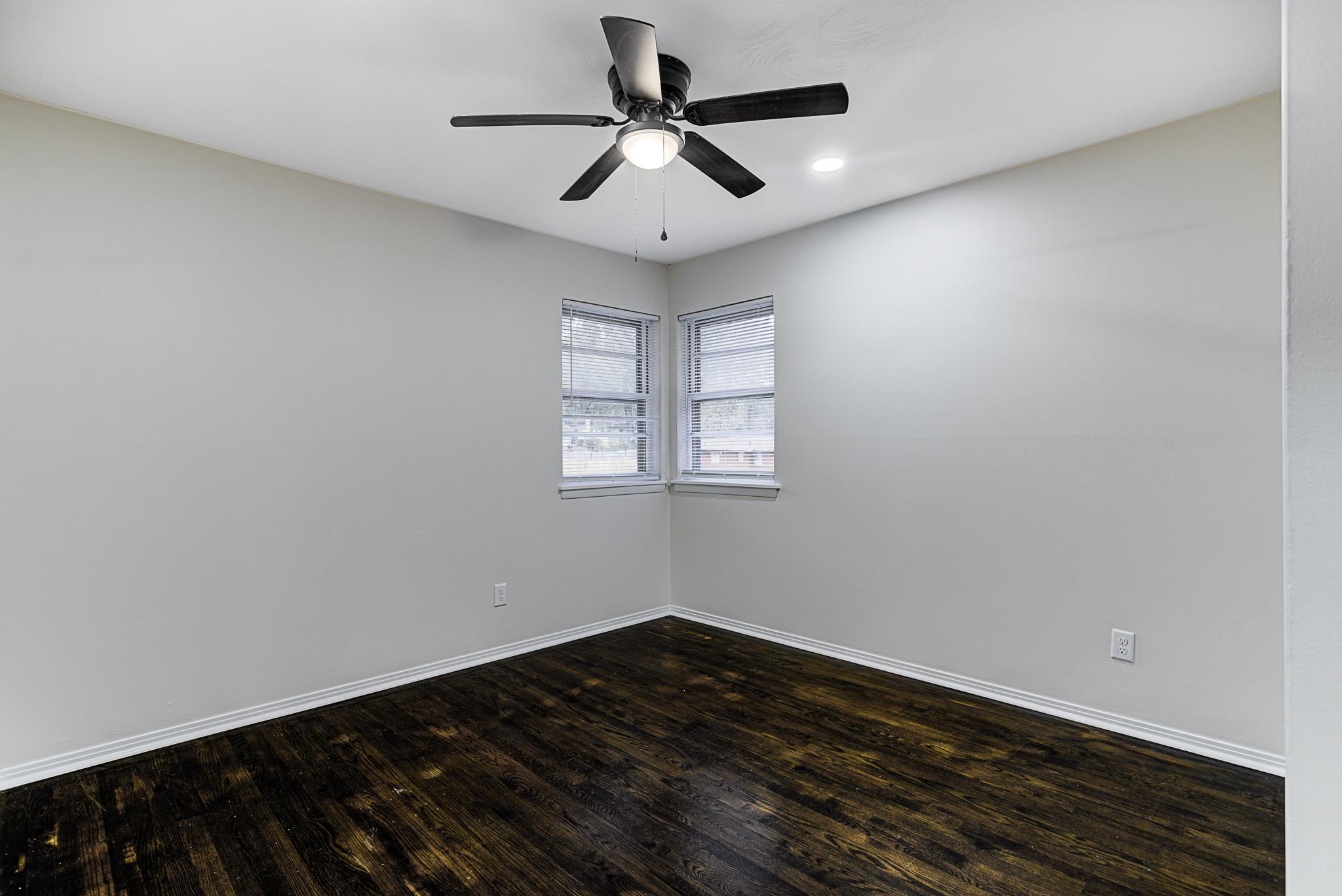 5094 Lochinvar Road Memphis, TN 38116 - Photo 16 of 23 Empty room with dark hardwood / wood-style floors and ceiling fan