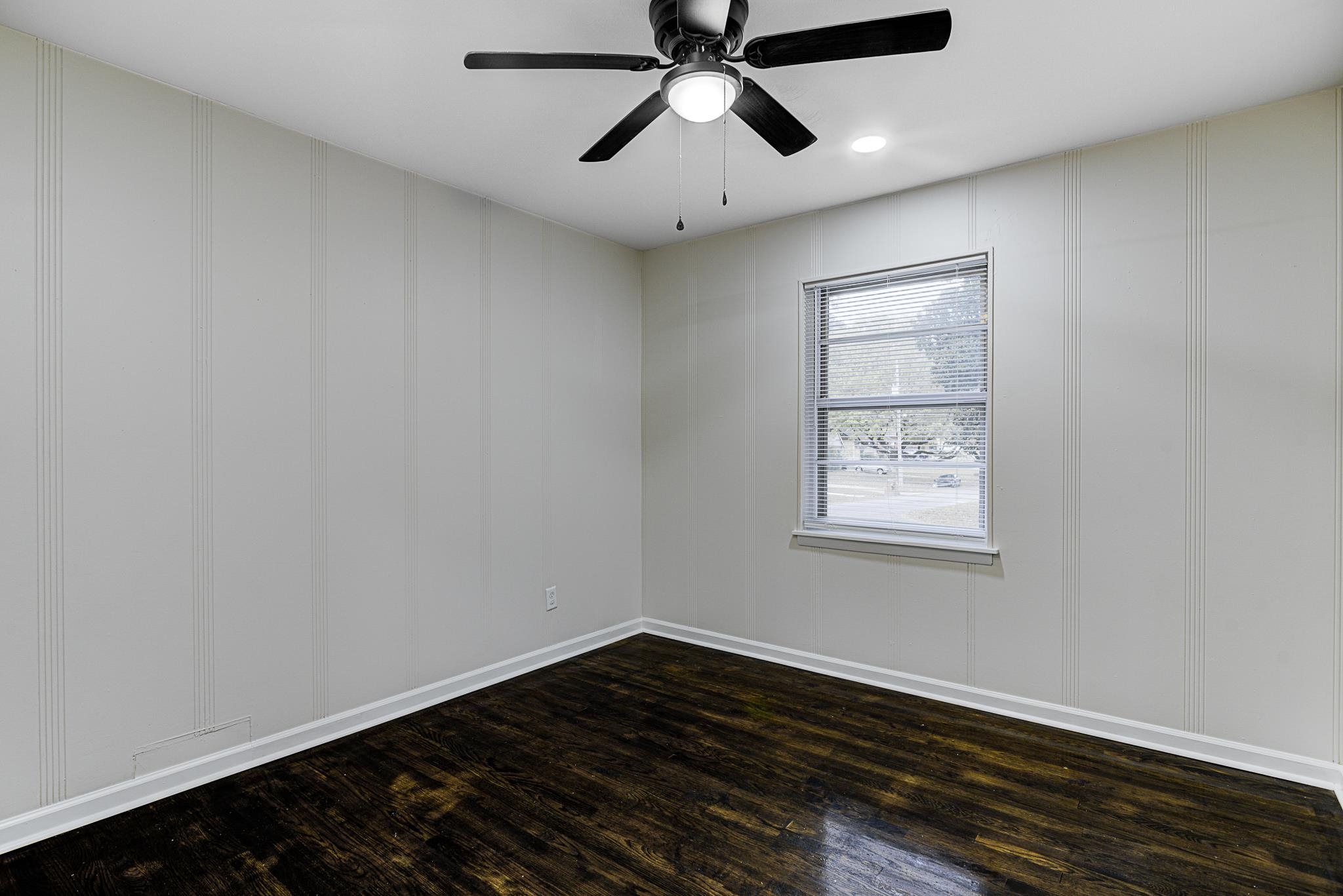 5094 Lochinvar Road Memphis, TN 38116 - Photo 18 of 23 Spare room featuring dark hardwood / wood-style floors and ceiling fan