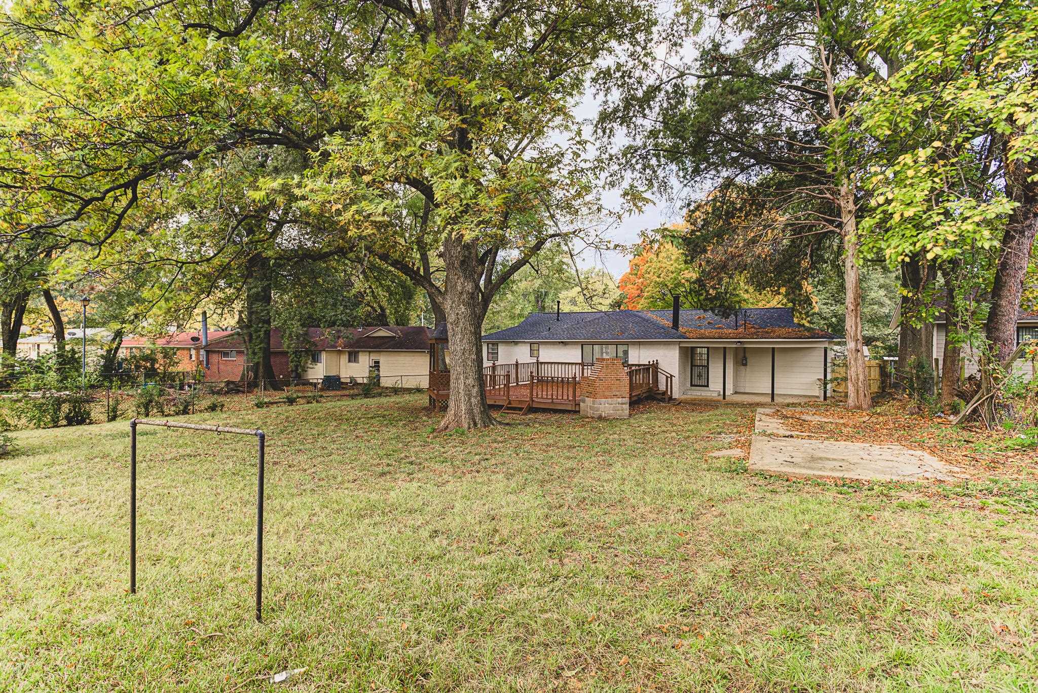 5094 Lochinvar Road Memphis, TN 38116 - Photo 20 of 23 View of yard featuring a wooden deck