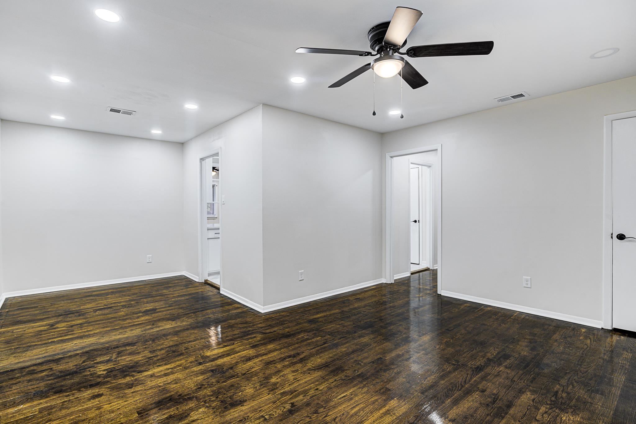 5094 Lochinvar Road Memphis, TN 38116 - Photo 4 of 23 Spare room with ceiling fan and dark hardwood / wood-style floors