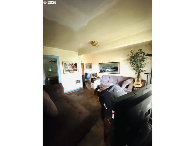 a living room with furniture and a table