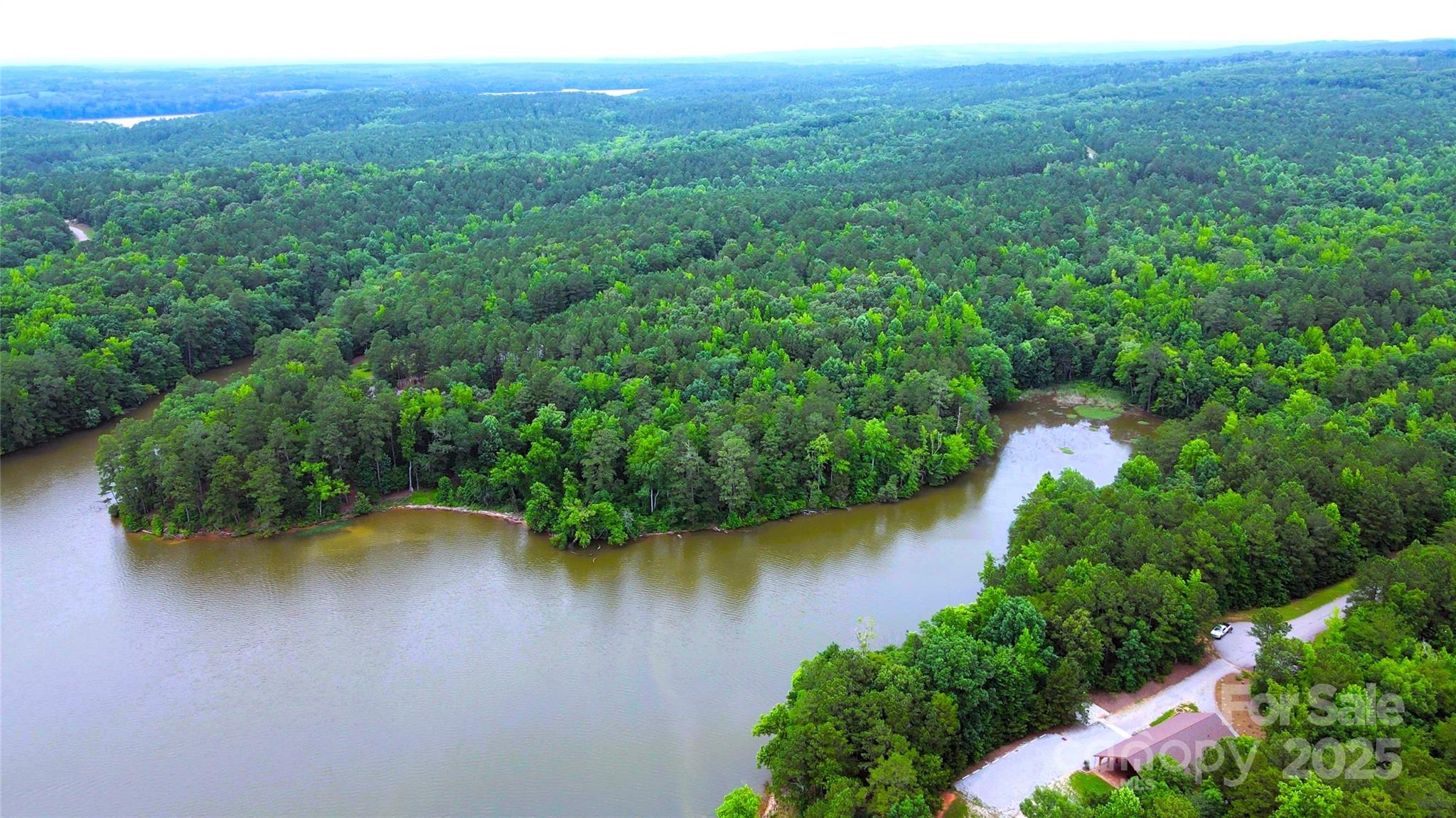 140 North State Lane Rockingham, NC 28379 - Photo 10 of 15 an aerial view of residential houses with outdoor space and lake view