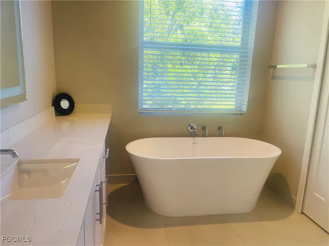 a white bath tub sitting in a bathroom