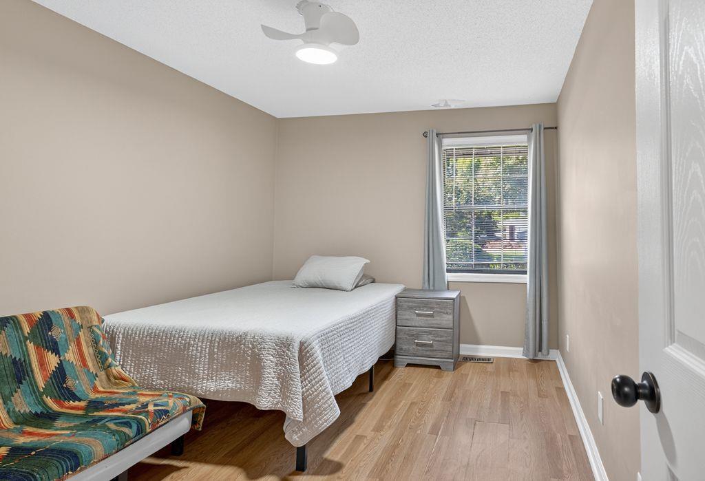 5970 WinterGreen Road Northwest Norcross, GA 30093 - Photo 22 of 34 a bedroom with a bed and window
