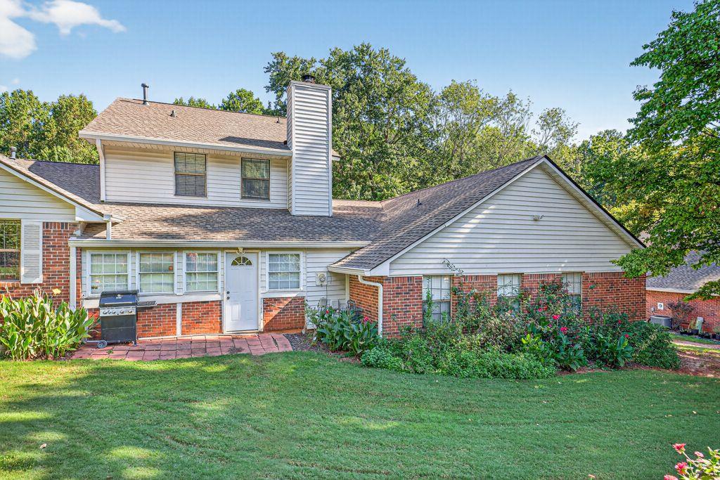 5970 WinterGreen Road Northwest Norcross, GA 30093 - Photo 29 of 34 a front view of a house with a yard