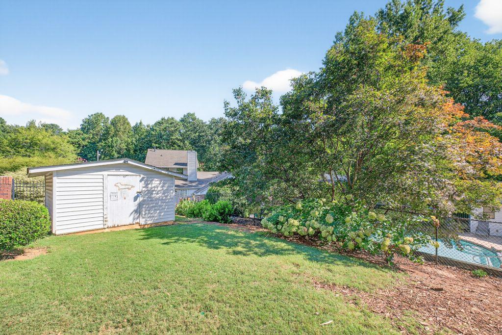 5970 WinterGreen Road Northwest Norcross, GA 30093 - Photo 33 of 34 a view of a yard with plants and large trees