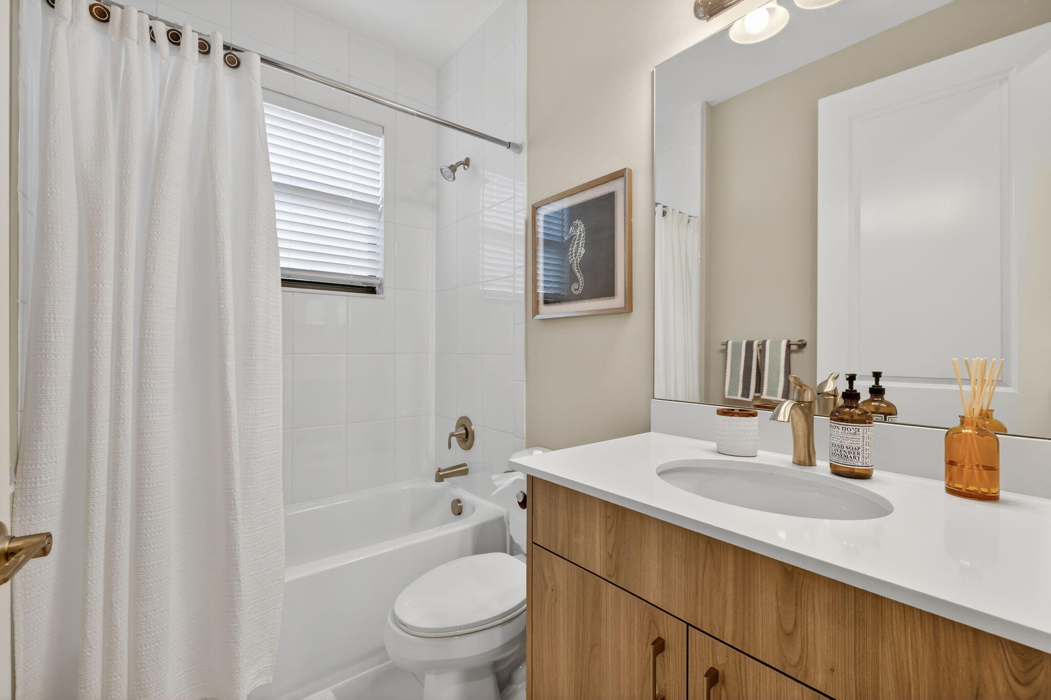12447 Southwest Blue Mangrove Parkway Port St. Lucie, FL 34987 - Photo 18 of 80 a bathroom with a sink a toilet and shower