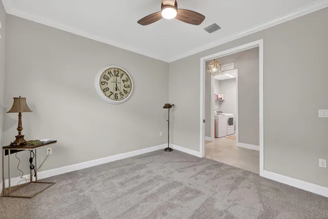 a view of a porch with furniture and garden