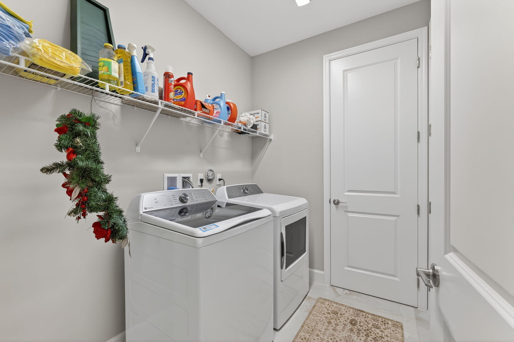 12447 Southwest Blue Mangrove Parkway Port St. Lucie, FL 34987 - Photo 27 of 80 a utility room with sink dryer and washer