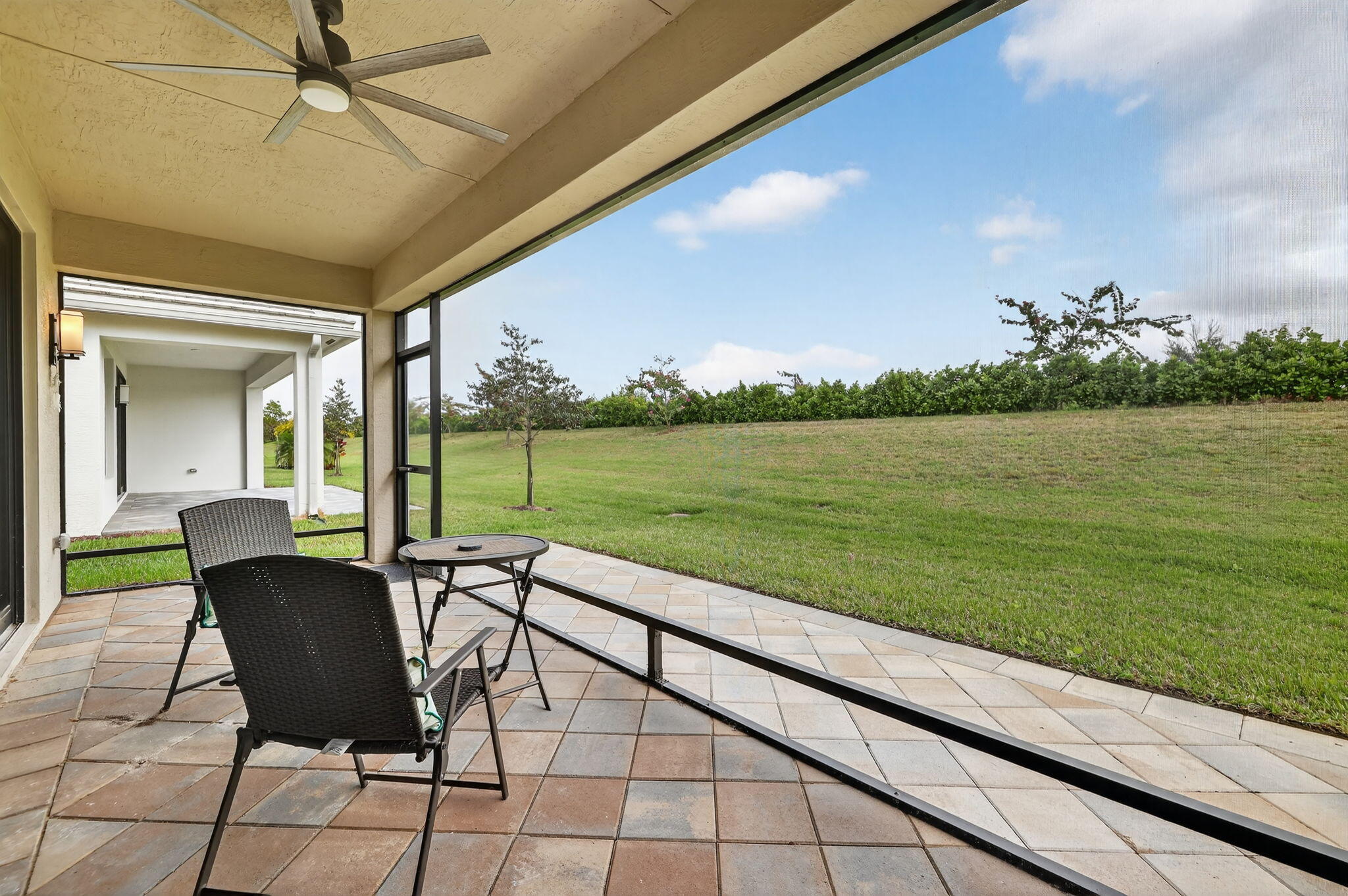 12447 Southwest Blue Mangrove Parkway Port St. Lucie, FL 34987 - Photo 30 of 80 a view of a chairs and table in the balcony