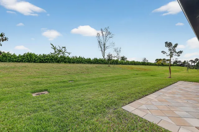 a view of a room with lots of counter space and a wooden floor