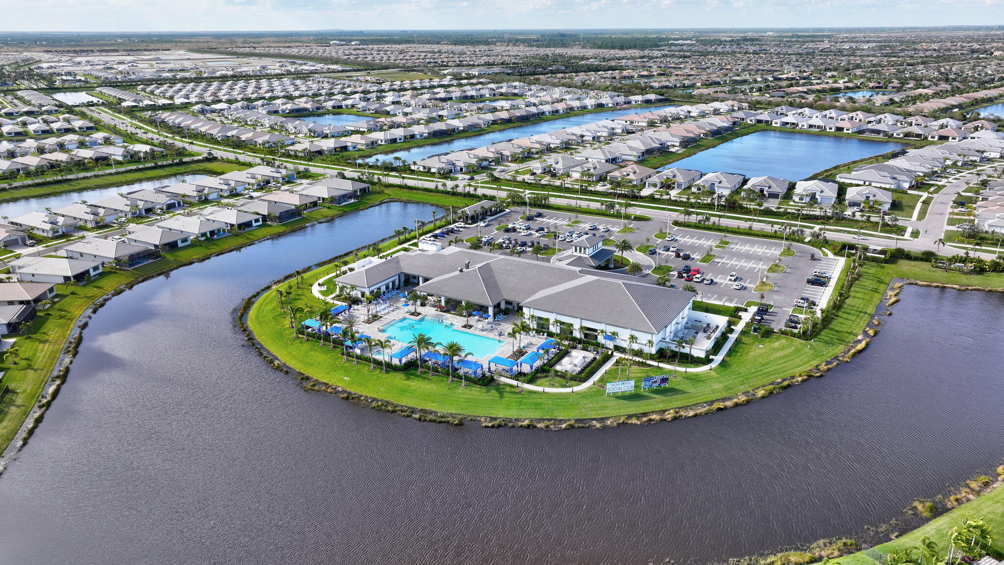 12447 Southwest Blue Mangrove Parkway Port St. Lucie, FL 34987 - Photo 63 of 80 a view of a swimming pool with a lake from a seating space