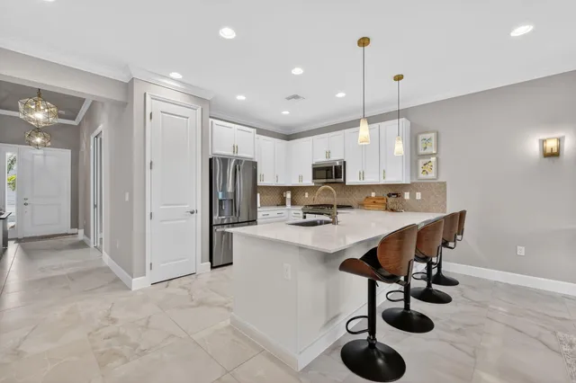 a living room with furniture potted plant and a window