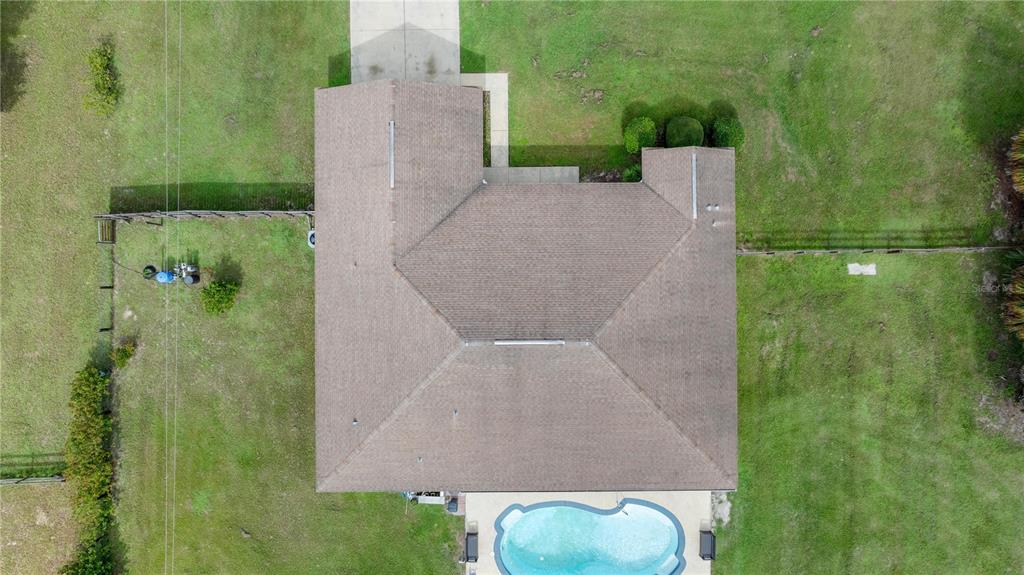 13783 Southeast 8th Court Ocala, FL 34480 - Photo 11 of 47 an aerial view of a house with a yard