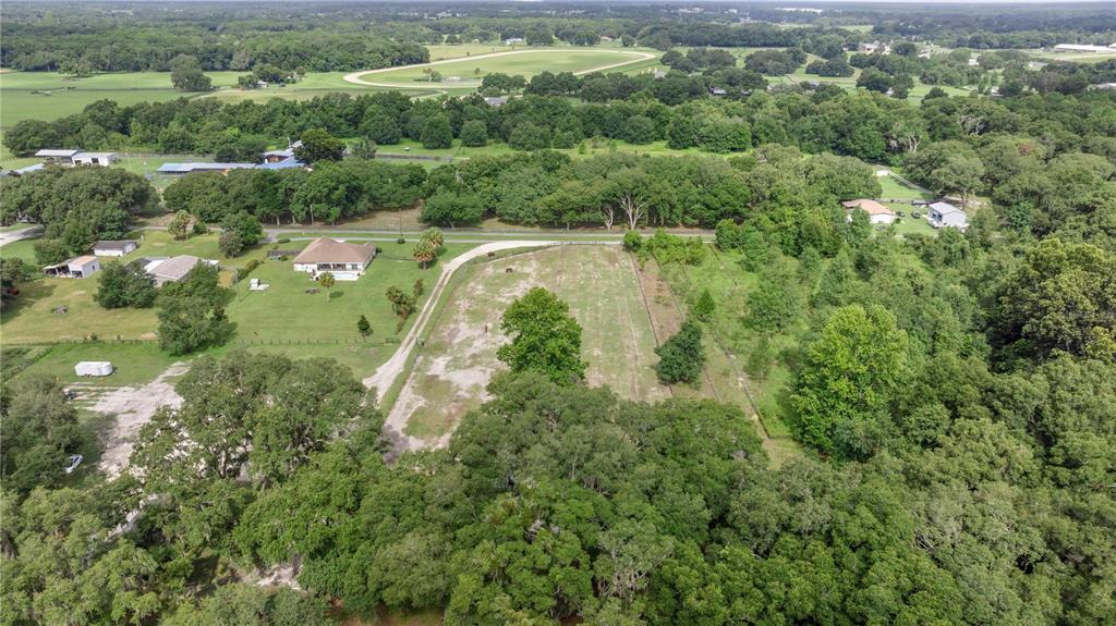 13783 Southeast 8th Court Ocala, FL 34480 - Photo 8 of 47 a view of a lake with a city