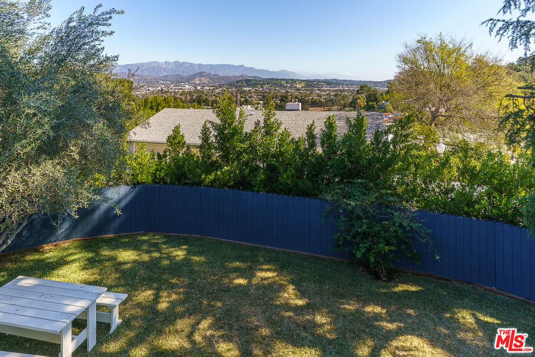 3347 Ley Drive Los Angeles, CA 90027 - Photo 12 of 54 a view of a swimming pool with a yard and mountain view