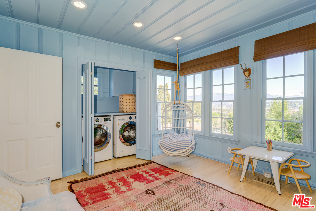 3347 Ley Drive Los Angeles, CA 90027 - Photo 16 of 54 a living room with a couch and a table