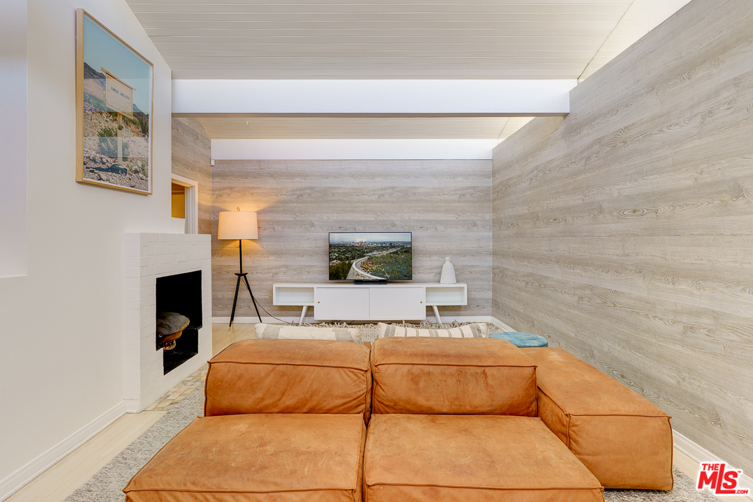 3347 Ley Drive Los Angeles, CA 90027 - Photo 28 of 54 a bedroom with a bed and a fireplace