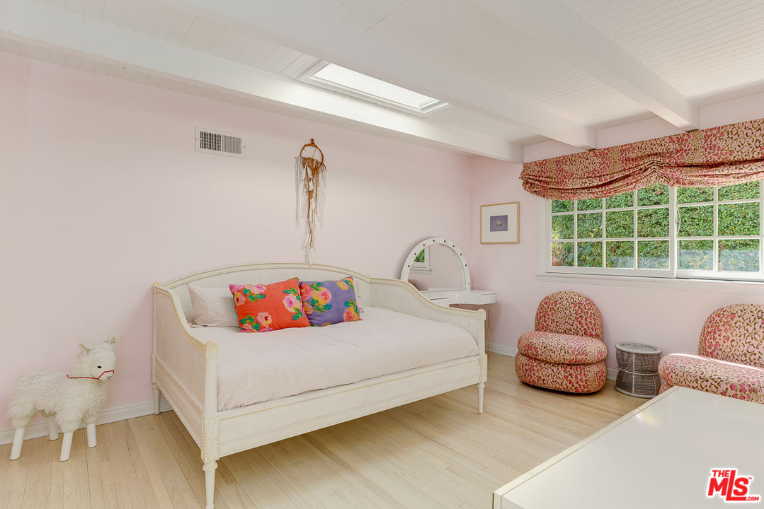 3347 Ley Drive Los Angeles, CA 90027 - Photo 29 of 54 a bedroom with a bed and a window