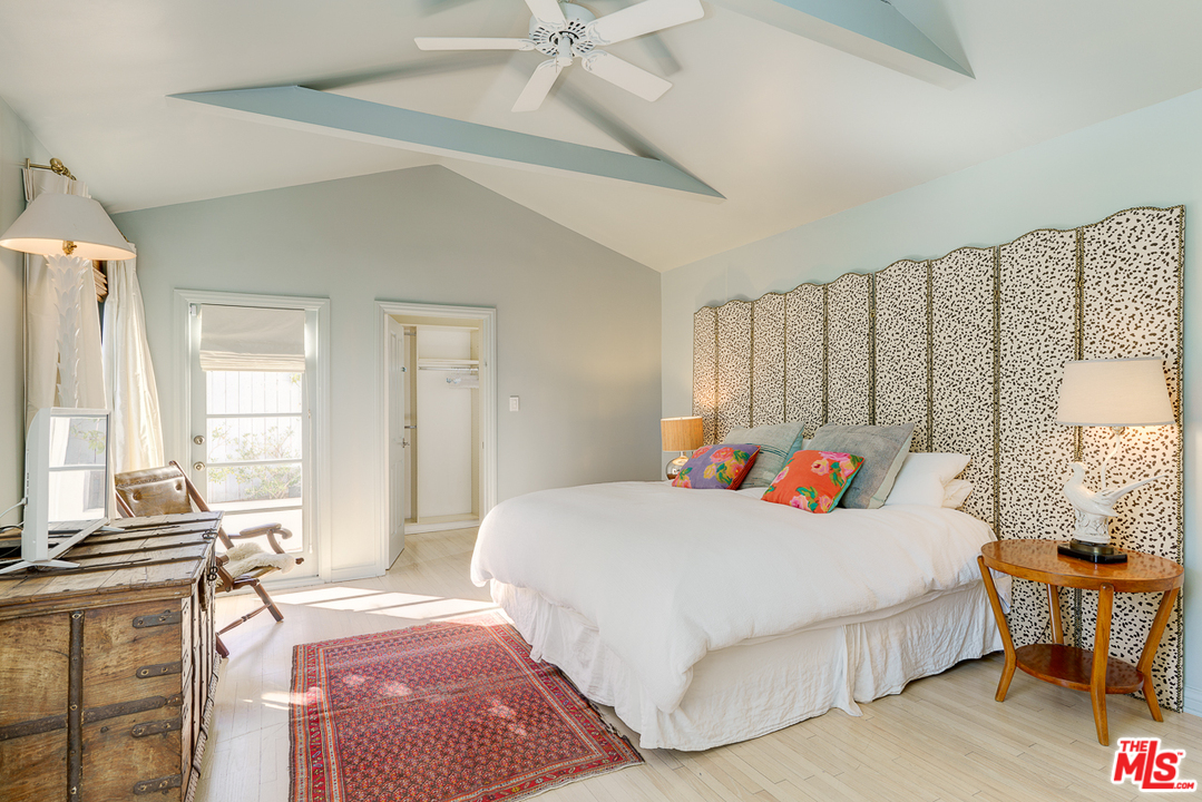 3347 Ley Drive Los Angeles, CA 90027 - Photo 37 of 54 a bedroom with a bed and a table with windows