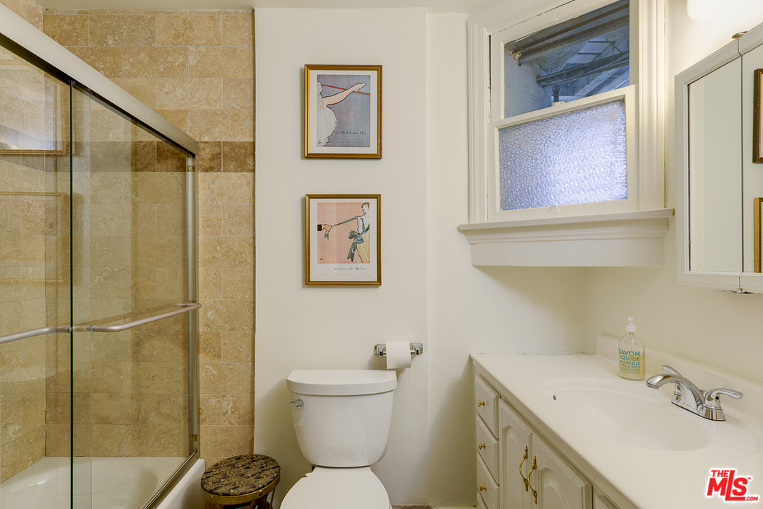 3347 Ley Drive Los Angeles, CA 90027 - Photo 42 of 54 a bathroom with a toilet sink and mirror