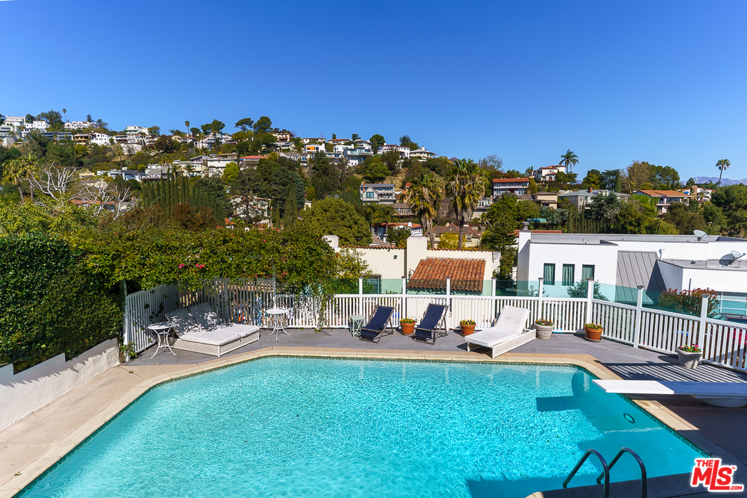 3347 Ley Drive Los Angeles, CA 90027 - Photo 43 of 54 a view of a swimming pool with a patio and a garden