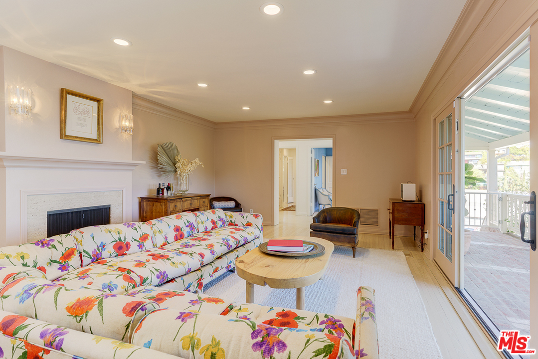 3347 Ley Drive Los Angeles, CA 90027 - Photo 9 of 54 a bedroom with furniture and a fireplace