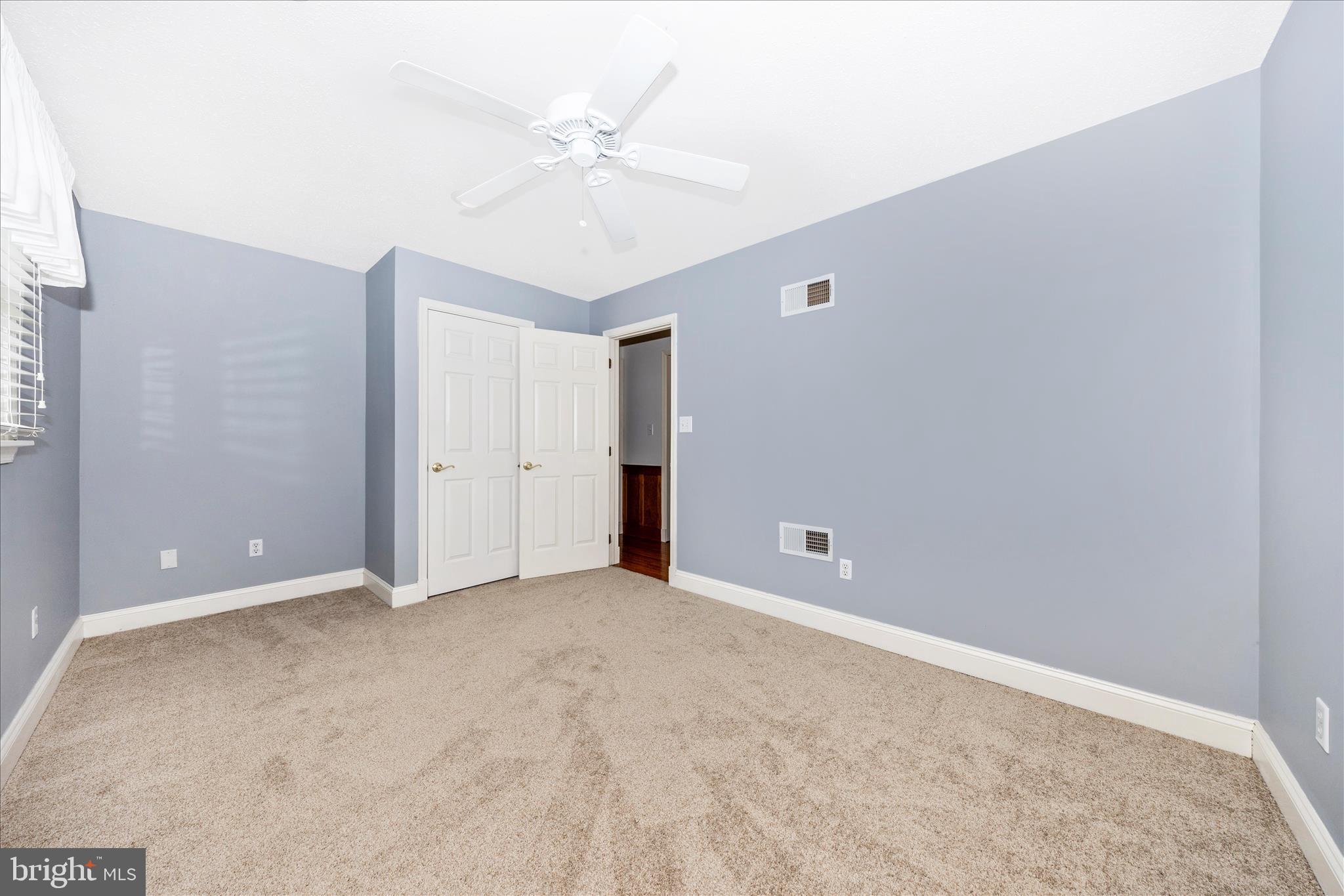 15810 Spade Road Hagerstown, MD 21740 - Photo 29 of 76 a view of an empty room with a ceiling fan