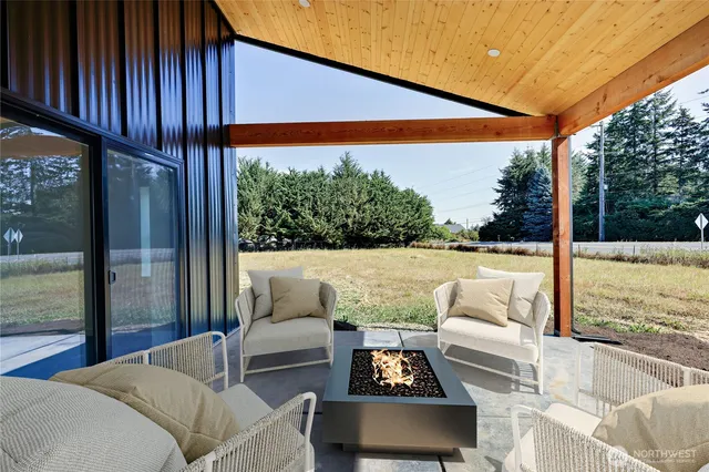 a outdoor living space with furniture and city view