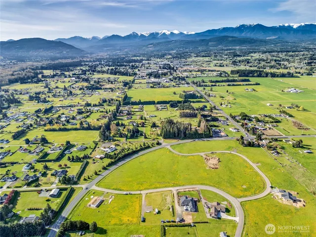 a view of a swimming pool with a table and chairs