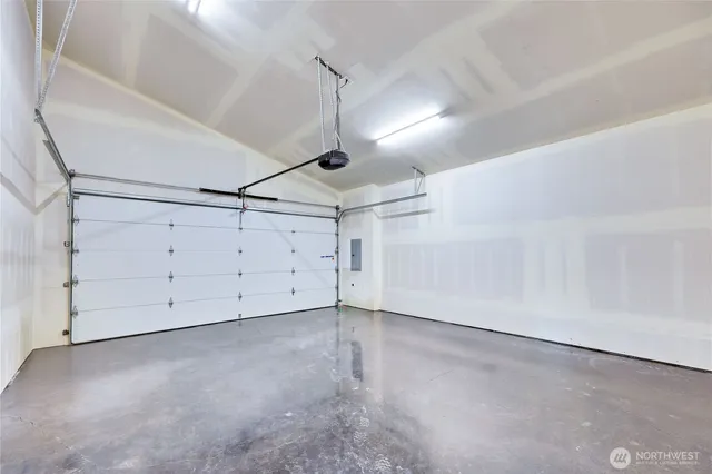 a view of a hallway with wooden floor and entryway
