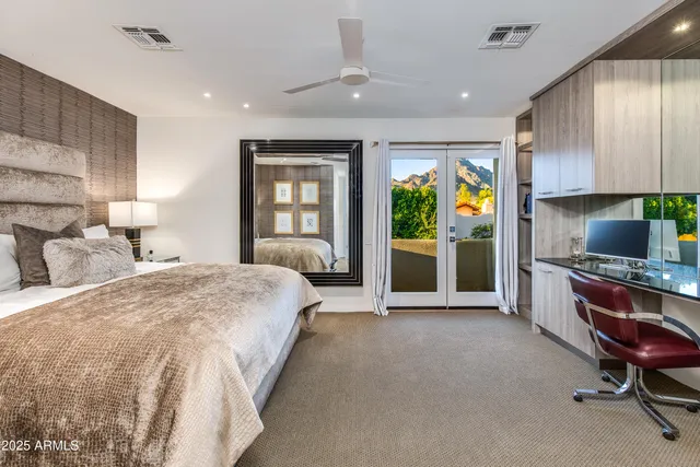 a view of a balcony with table and chairs