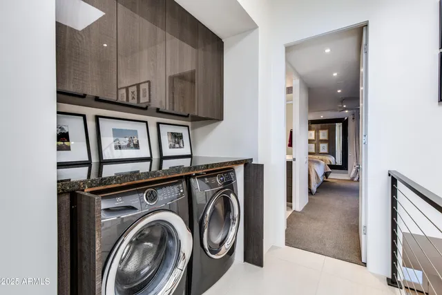 a view of a patio with table and chairs and potted plants