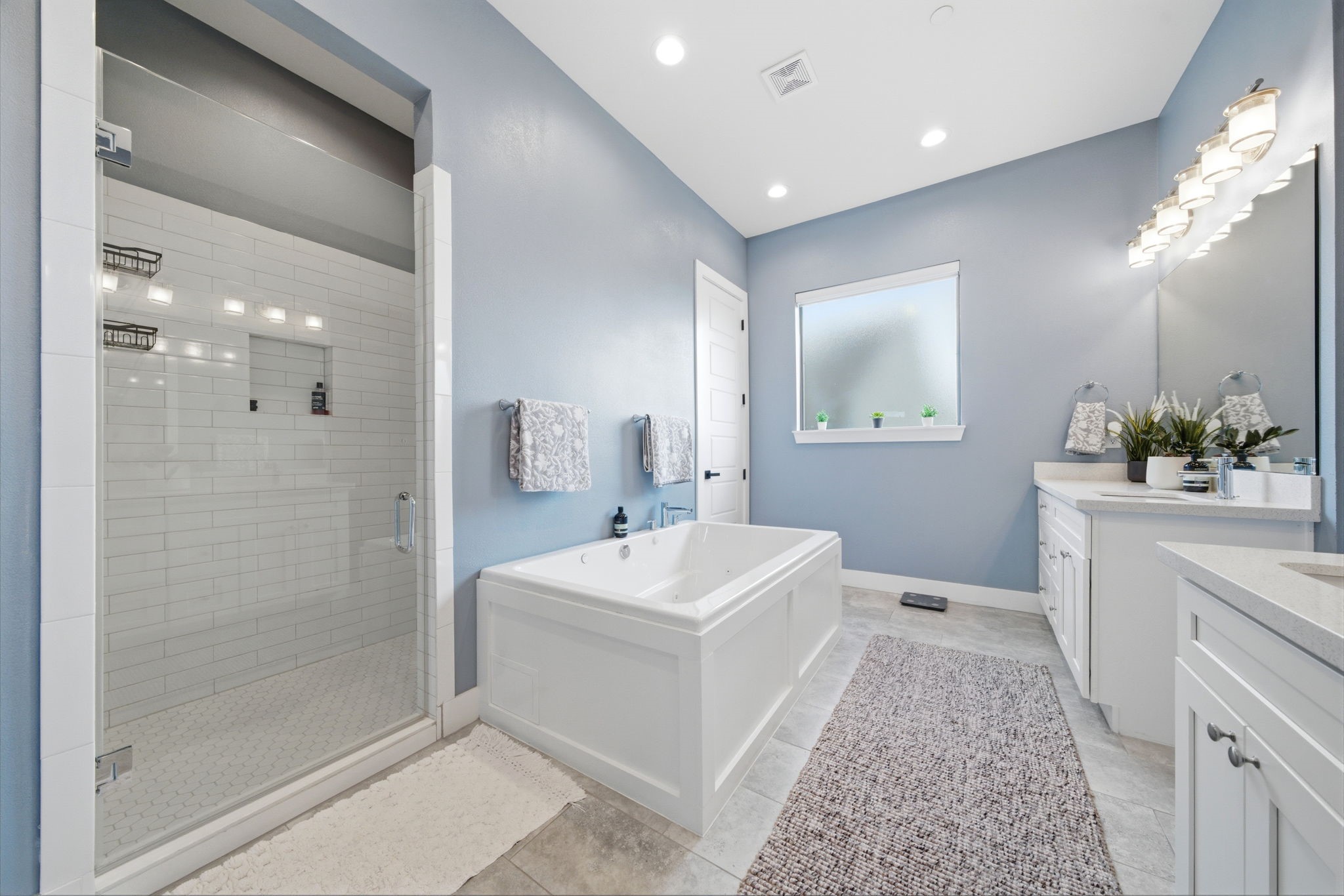 4306 Center Street Houston, TX 77007 - Photo 14 of 28 a bathroom with a sink a toilet a mirror and shower