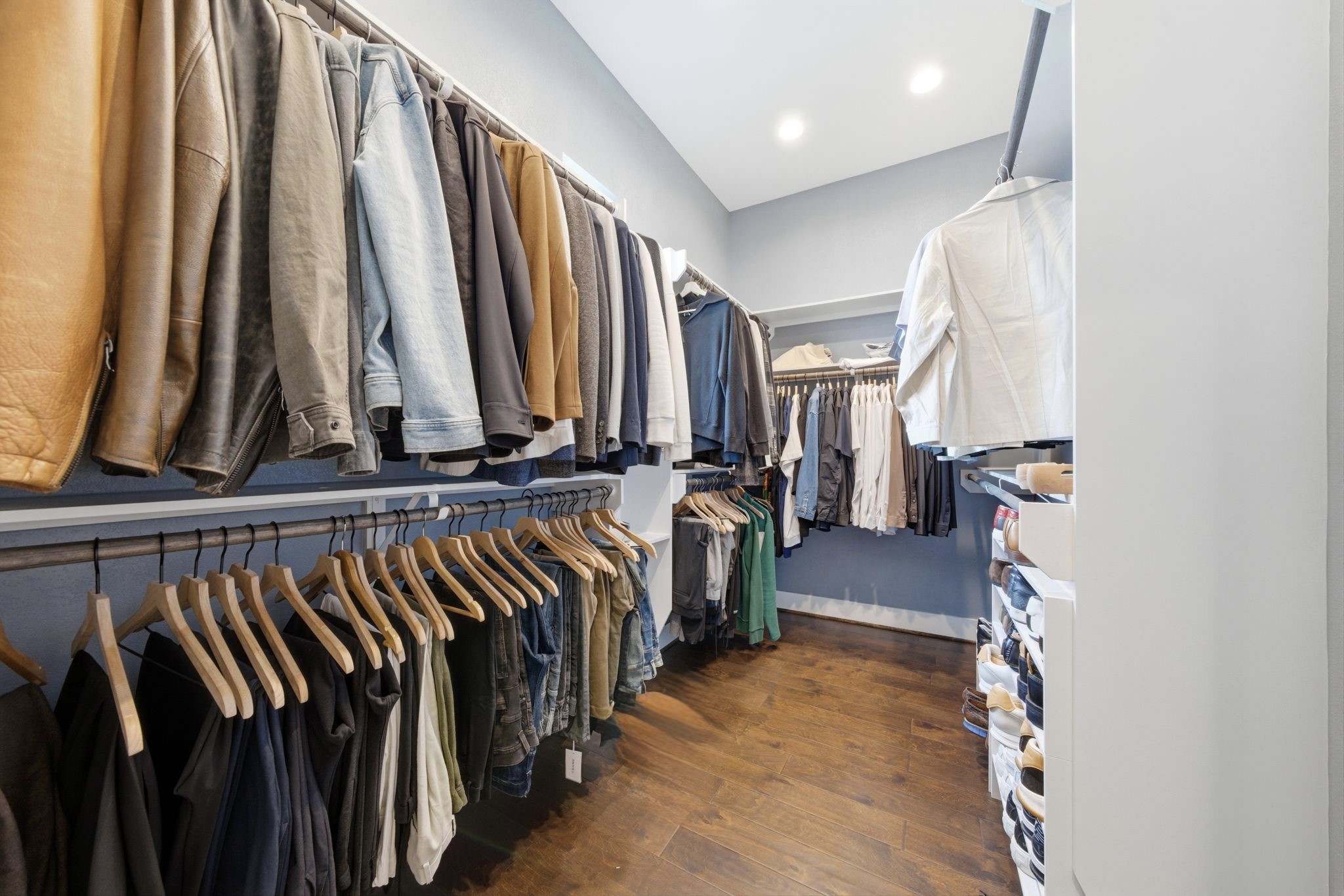 4306 Center Street Houston, TX 77007 - Photo 15 of 28 a view of walk in closet with clothes and shoes