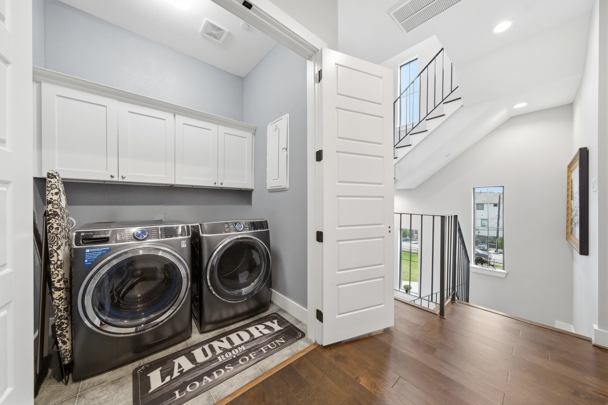 4306 Center Street Houston, TX 77007 - Photo 17 of 28 a view of a hallway with washer and dryer