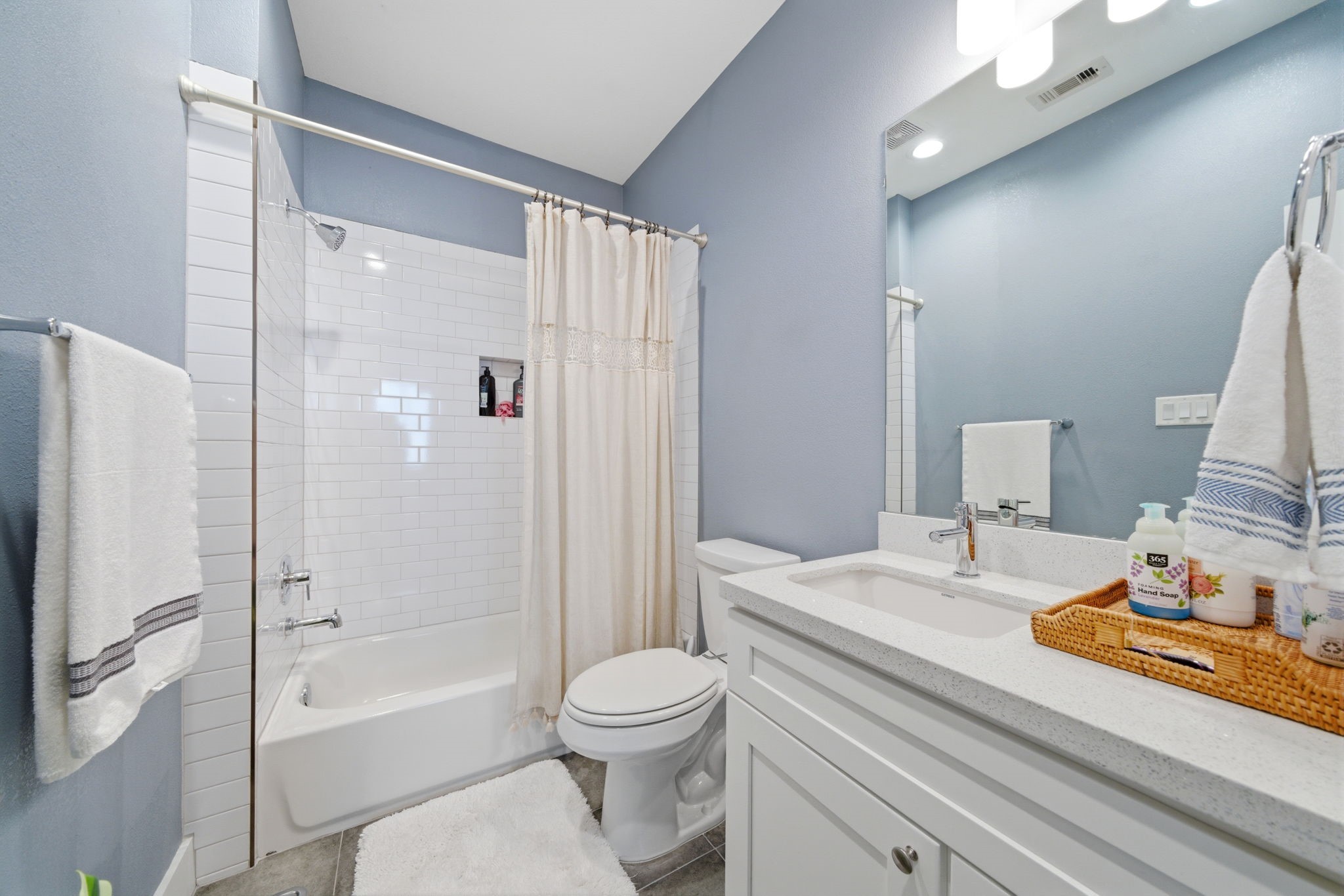 4306 Center Street Houston, TX 77007 - Photo 19 of 28 a bathroom with a sink a toilet and a large mirror