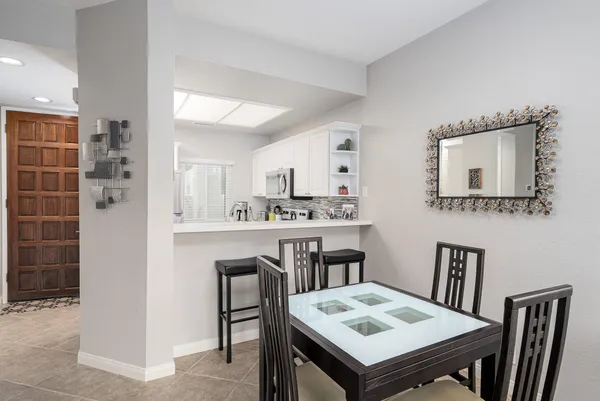 a open kitchen with a table and chairs