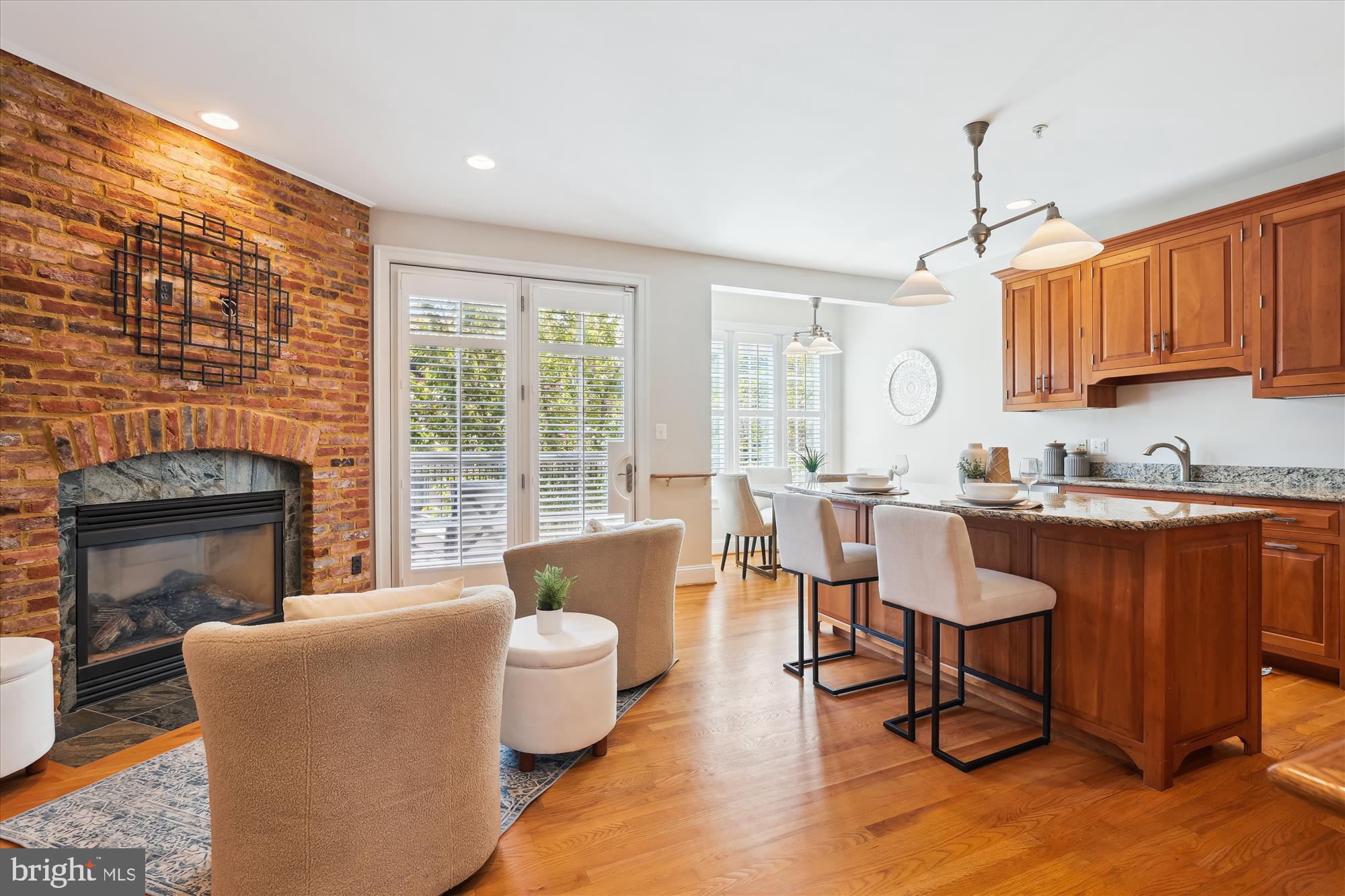 229 Locust Street Southeast, Unit 3 Vienna, VA 22180 - Photo 12 of 57 a living room with fireplace furniture and a wooden floor