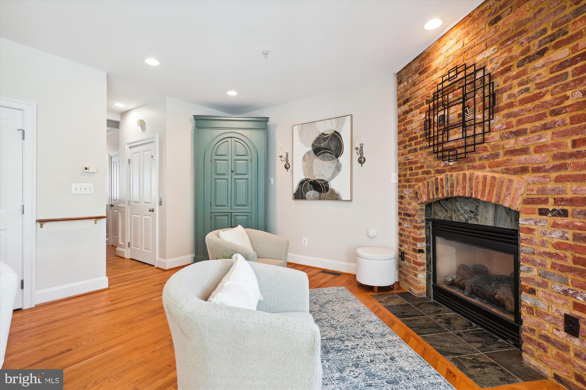 229 Locust Street Southeast, Unit 3 Vienna, VA 22180 - Photo 14 of 57 a living room with furniture and a fireplace