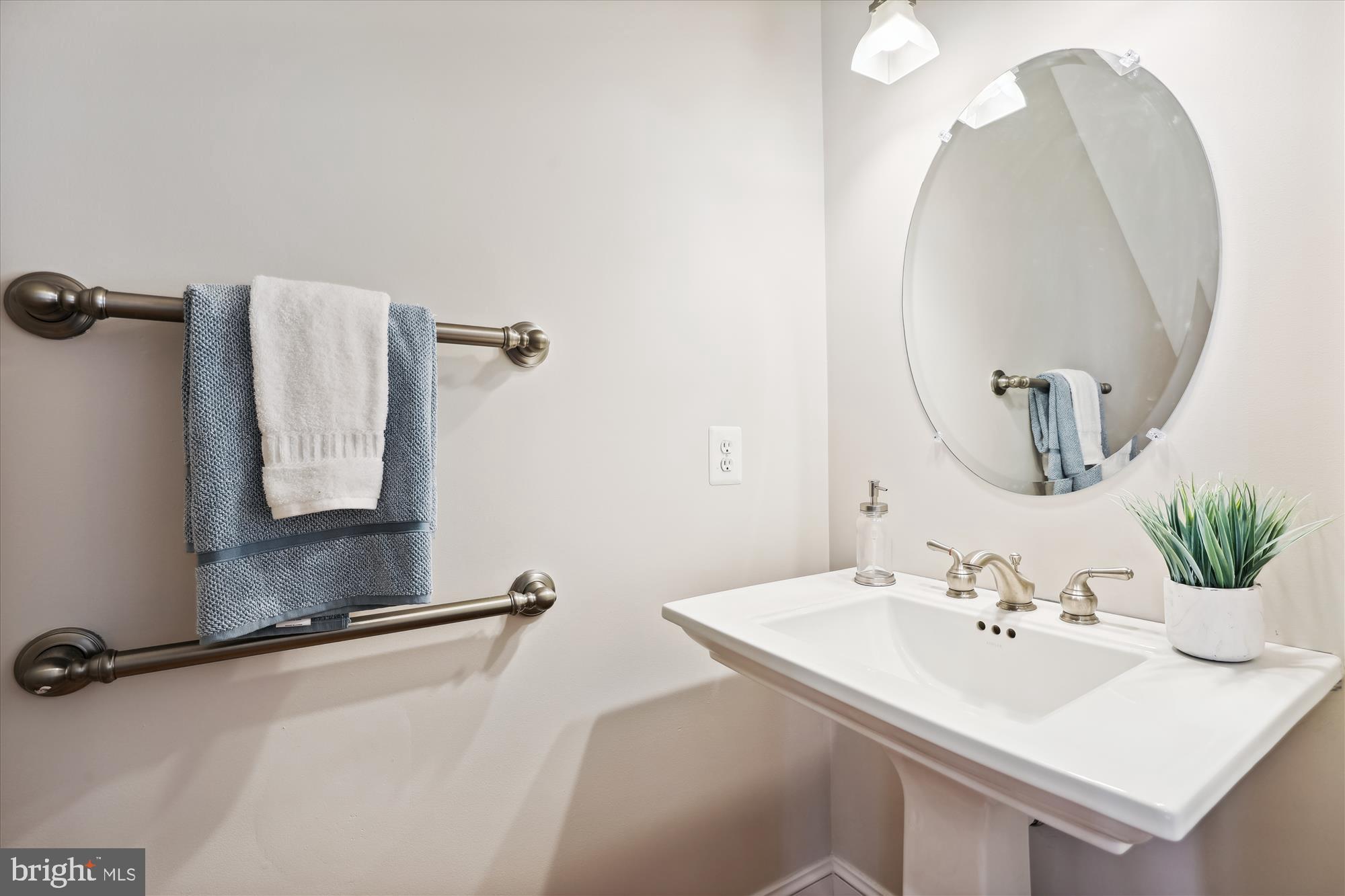 229 Locust Street Southeast, Unit 3 Vienna, VA 22180 - Photo 17 of 57 a bathroom with a sink and mirror