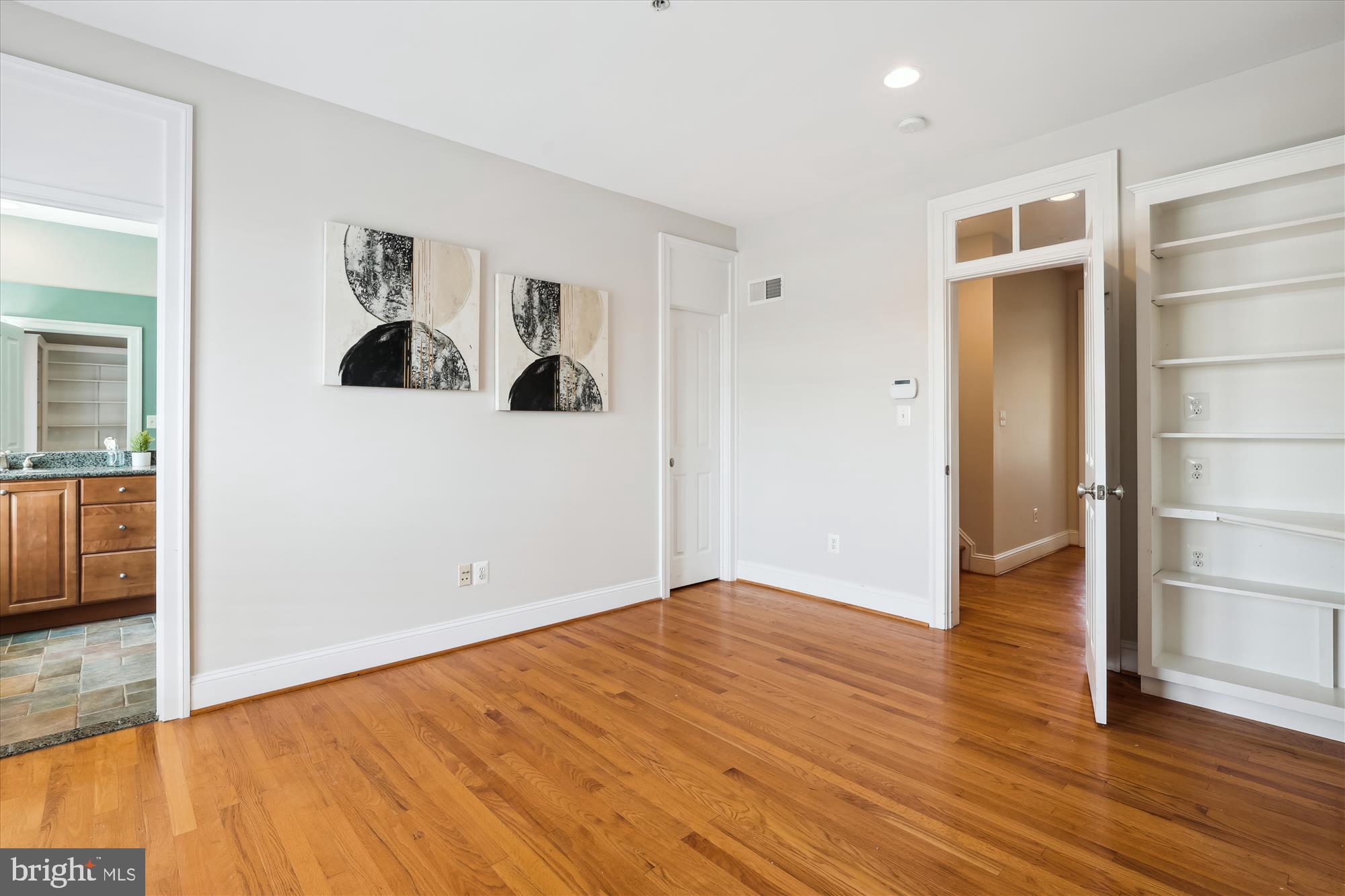 229 Locust Street Southeast, Unit 3 Vienna, VA 22180 - Photo 21 of 57 wooden floor in an empty room with a window