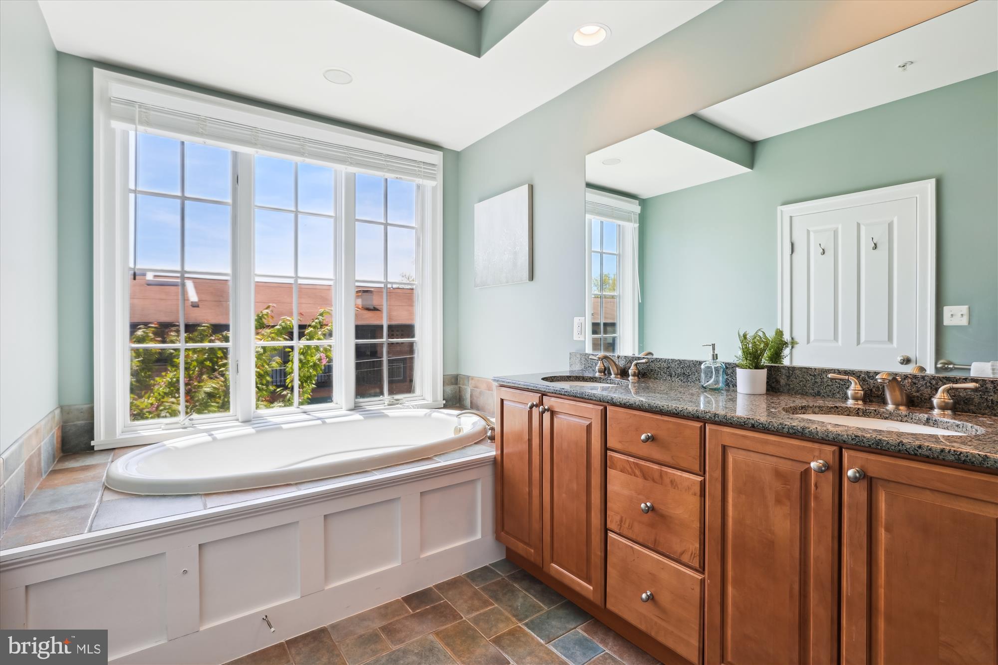 229 Locust Street Southeast, Unit 3 Vienna, VA 22180 - Photo 23 of 57 a bathroom with double vanity and a large mirror