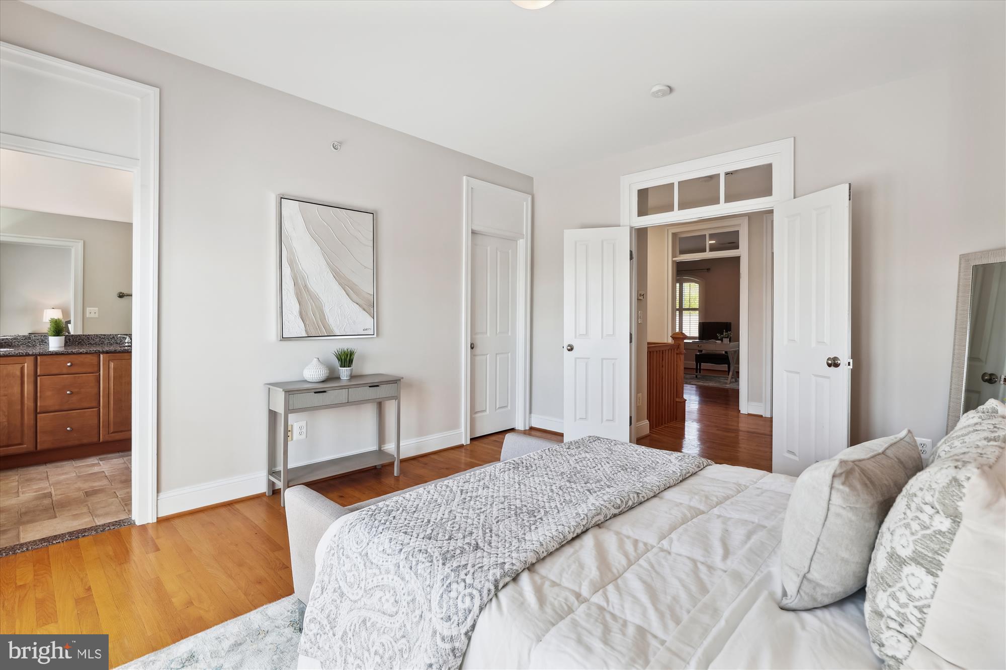 229 Locust Street Southeast, Unit 3 Vienna, VA 22180 - Photo 34 of 57 a bedroom with a bed and a table