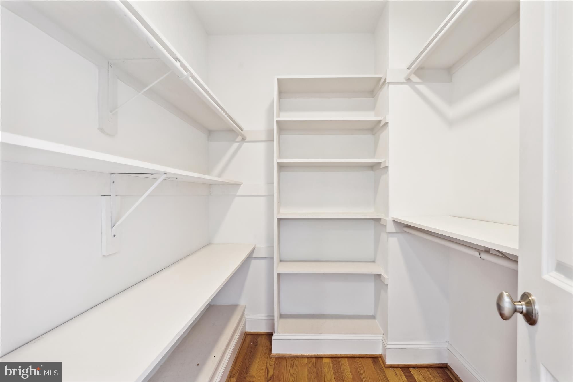 229 Locust Street Southeast, Unit 3 Vienna, VA 22180 - Photo 38 of 57 a view of walk in closet with empty racks