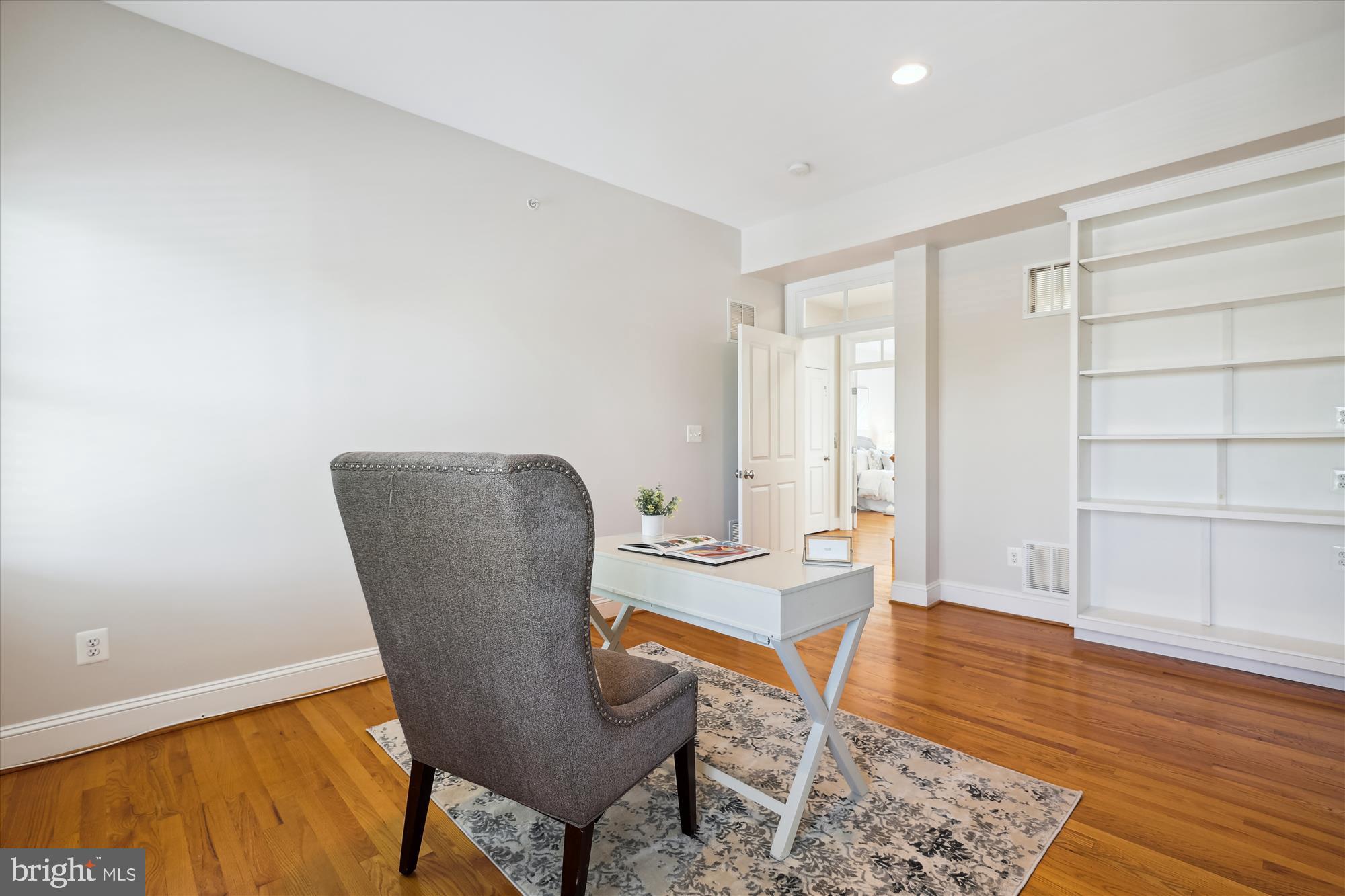 229 Locust Street Southeast, Unit 3 Vienna, VA 22180 - Photo 42 of 57 a workspace with furniture and wooden floor