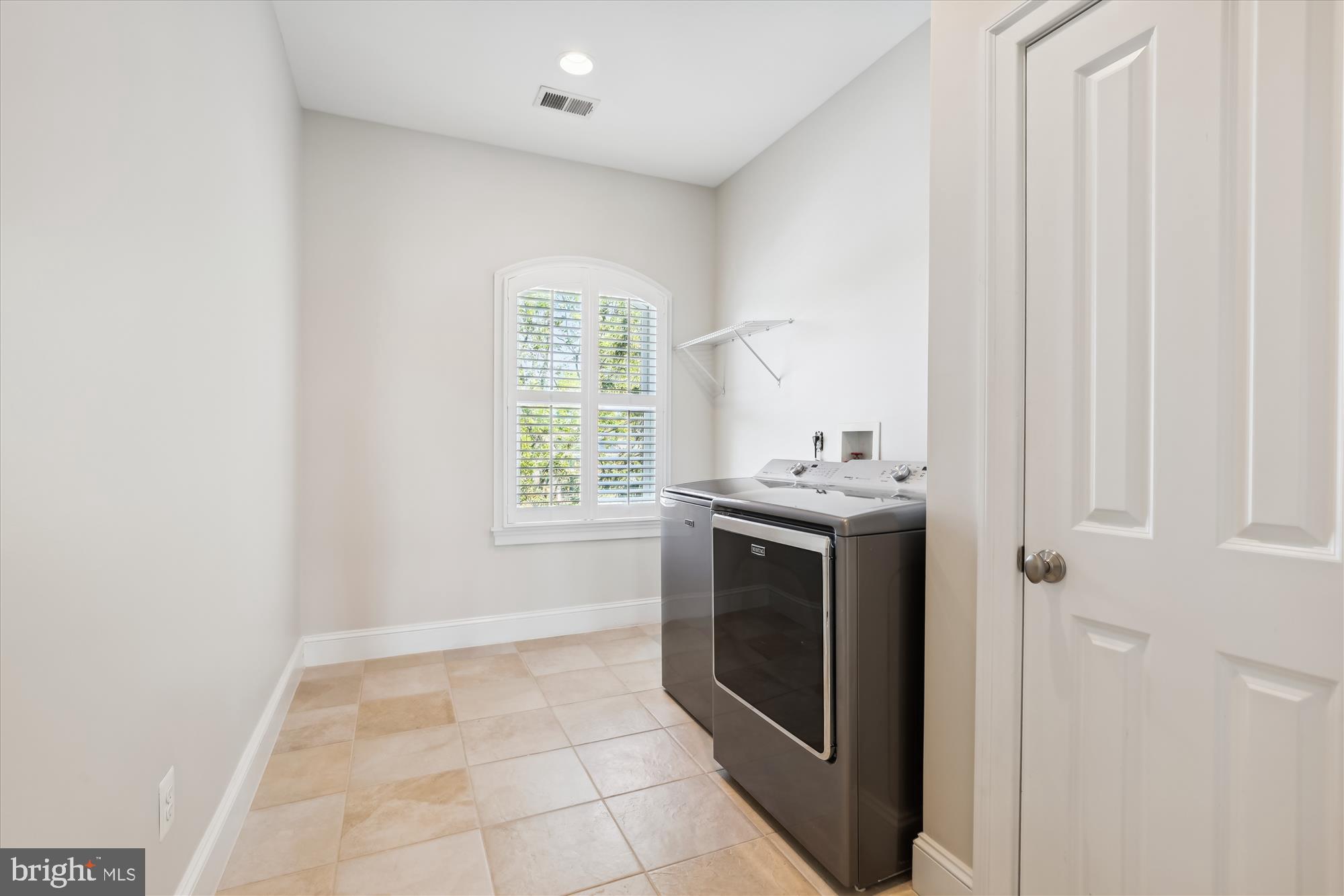 229 Locust Street Southeast, Unit 3 Vienna, VA 22180 - Photo 44 of 57 a utility room with washer and dryer