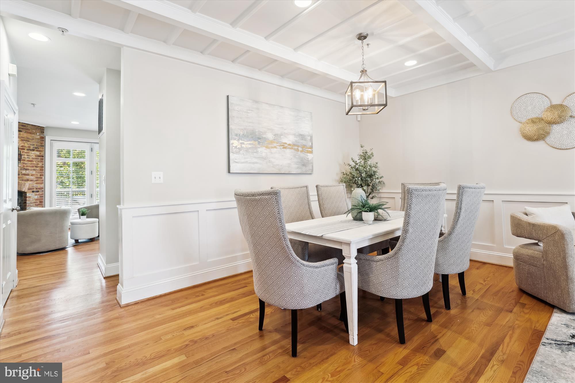 229 Locust Street Southeast, Unit 3 Vienna, VA 22180 - Photo 8 of 57 a view of a dining room with furniture wooden floor and a chandelier